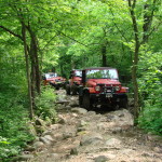 The group making its way through one of the Badlands trails filled with scattered boulders.